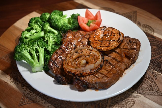 Grilled steak served with vegetables
