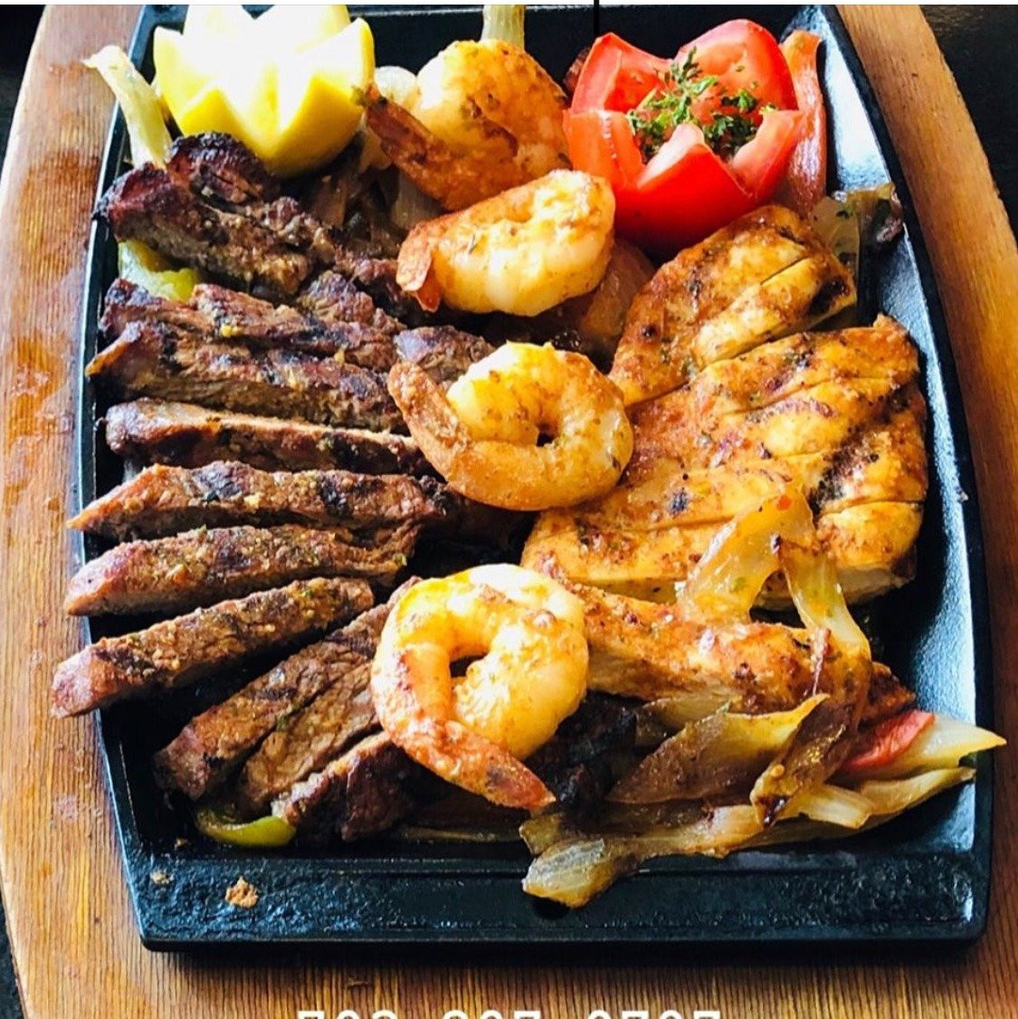 Argentinian mixed grilled meat and shrimp platter